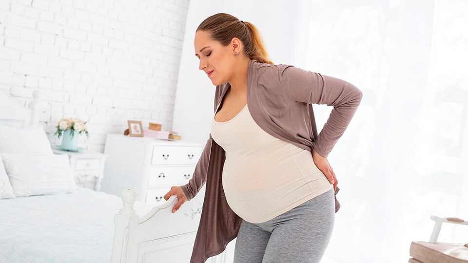Почему болит поясница при беременности